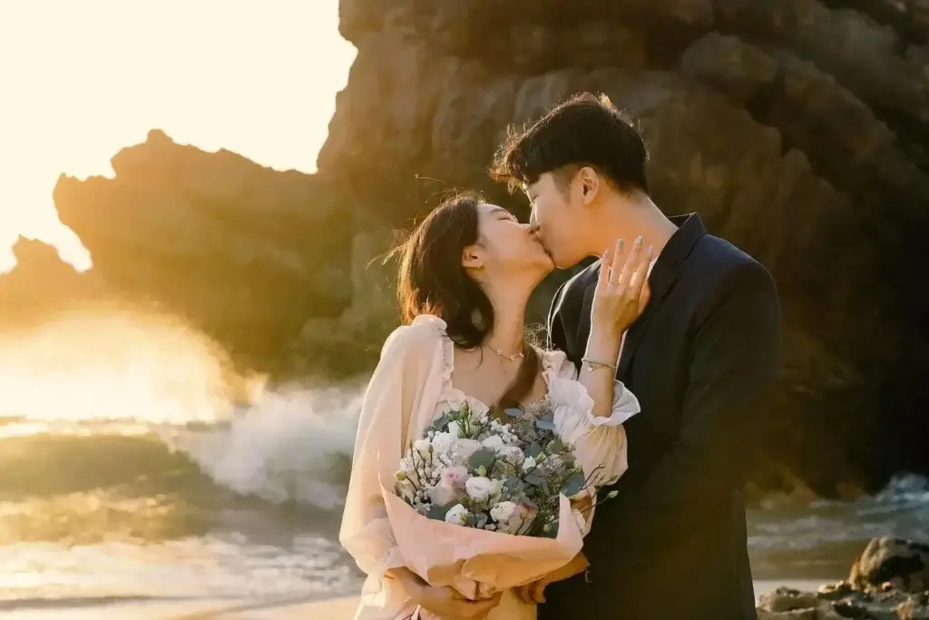 Tessellate Singapore engaged couple kissing